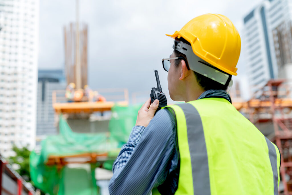 back view of professional engineer asian male safety helmet mana